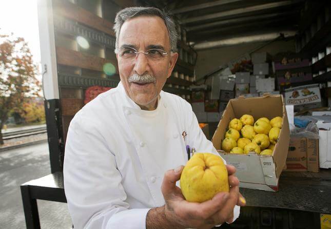 Chef Faz Poursohi checks the fresh quince from Fresno that he buys from "Uncle" Ray Nazari of Valley Fresh Produce and Groceries outside of Faz Restaurant and Bar in San Jose, Calif., on Wednesday, Dec. 9, 2015. Faz uses the quince to make quince preserves. (LiPo Ching/Bay Area News Group)